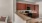 a kitchen with wooden cabinets