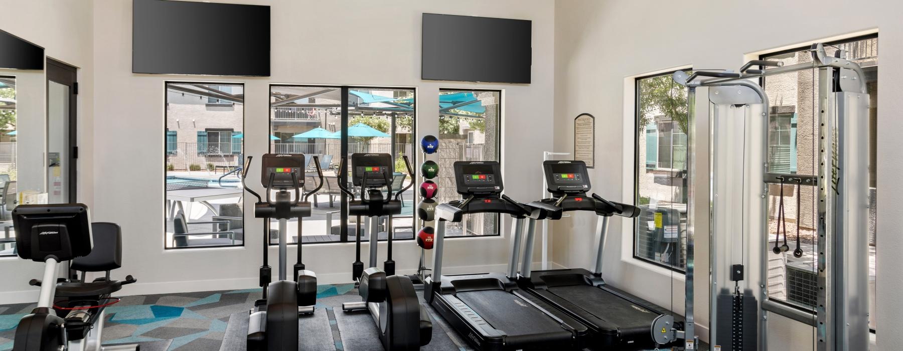 a room with treadmills and treadmills