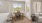 a living room with a table and chairs
