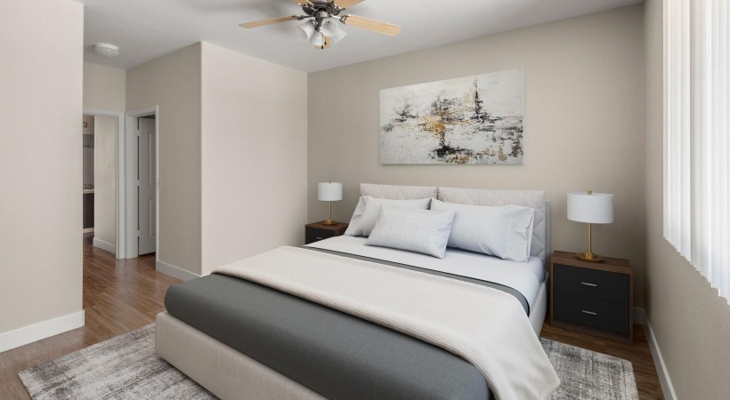 a bedroom with a ceiling fan