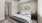 a bedroom with a ceiling fan