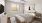 a bedroom with a bed and a fan