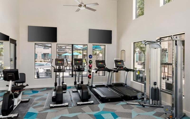 a room with treadmills and treadmills