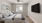a bedroom with a bed and a television