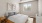 a bedroom with a fan